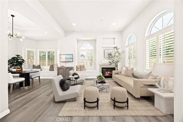 407 E Duarte Rd Unit D, Arcadia, CA 91006 - living area with a glass covered fireplace, wood finished floors, a chandelier, and recessed lighting
