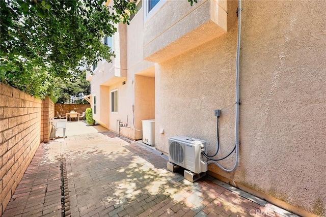 407 E Duarte Rd Unit D, Arcadia, CA 91006 - view of home's exterior with stucco siding, a cooling unit, a fenced backyard, and a patio area