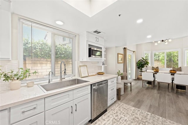 407 E Duarte Rd Unit D, Arcadia, CA 91006 - kitchen with stainless steel appliances, a sink, white cabinets, light wood-style flooring, and recessed lighting