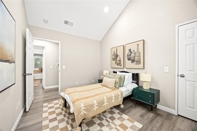 407 E Duarte Rd Unit D, Arcadia, CA 91006 - bedroom with light wood-style flooring, vaulted ceiling, and baseboards