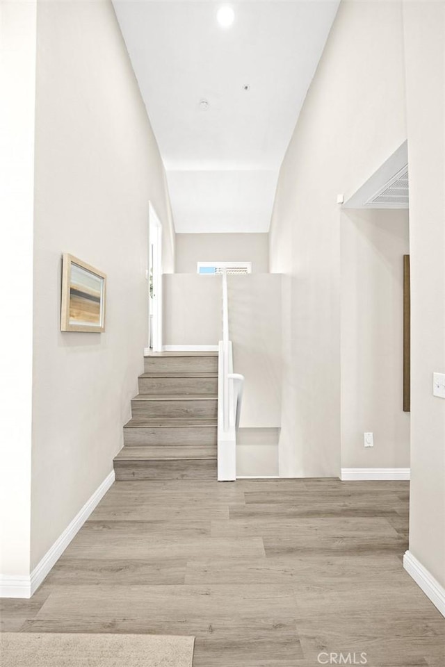 407 E Duarte Rd Unit D, Arcadia, CA 91006 - stairs with wood finished floors, baseboards, and recessed lighting
