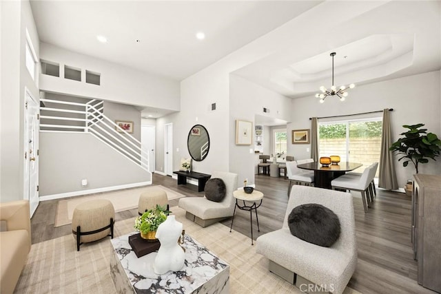 407 E Duarte Rd Unit D, Arcadia, CA 91006 - living area featuring wood finished floors, stairway, a chandelier, recessed lighting, and baseboards