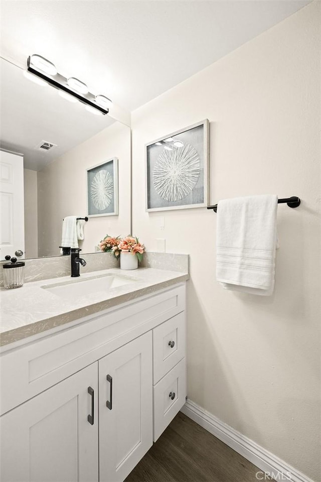 407 E Duarte Rd Unit D, Arcadia, CA 91006 - bathroom featuring vanity, wood finished floors, and baseboards