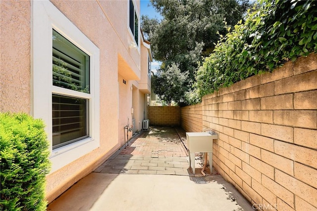 407 E Duarte Rd Unit D, Arcadia, CA 91006 - view of side of home with stucco siding, a patio, and a fenced backyard