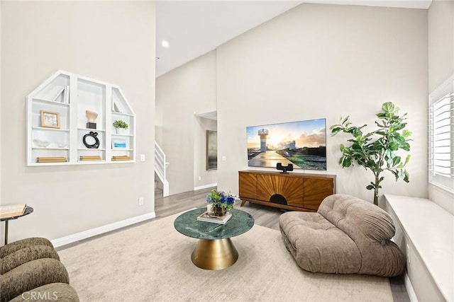 407 E Duarte Rd Unit D, Arcadia, CA 91006 - living room featuring high vaulted ceiling, wood finished floors, baseboards, and stairs