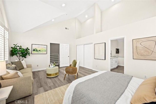 407 E Duarte Rd Unit D, Arcadia, CA 91006 - bedroom featuring wood finished floors, high vaulted ceiling, baseboards, recessed lighting, and ensuite bathroom