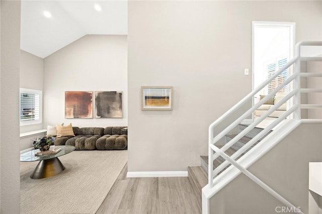 407 E Duarte Rd Unit D, Arcadia, CA 91006 - living area featuring wood finished floors, stairs, baseboards, vaulted ceiling, and recessed lighting