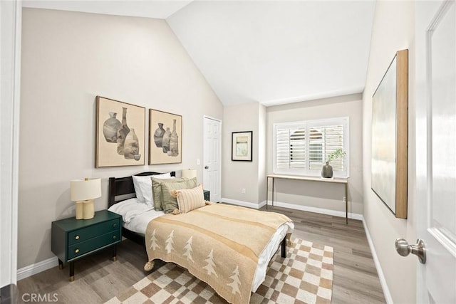 407 E Duarte Rd Unit D, Arcadia, CA 91006 - bedroom with lofted ceiling, wood finished floors, and baseboards