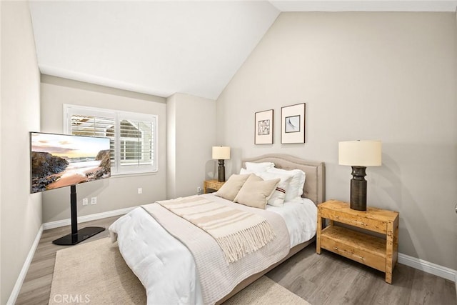 407 E Duarte Rd Unit D, Arcadia, CA 91006 - bedroom with baseboards, wood finished floors, and vaulted ceiling