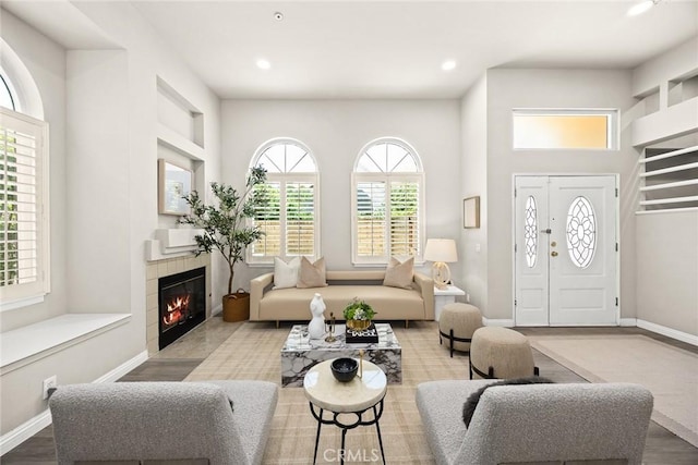 407 E Duarte Rd Unit D, Arcadia, CA 91006 - living area featuring wood finished floors, recessed lighting, a fireplace, and baseboards