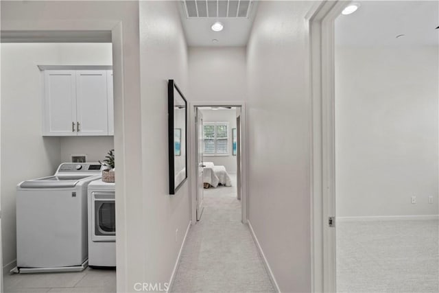166 Borrego, Irvine, CA 92618 - washroom featuring washer and dryer, cabinet space, light colored carpet, and baseboards