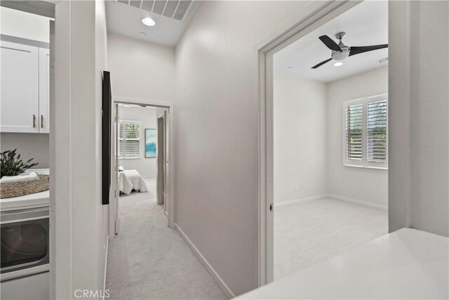 166 Borrego, Irvine, CA 92618 - hall featuring light carpet, baseboards, and recessed lighting