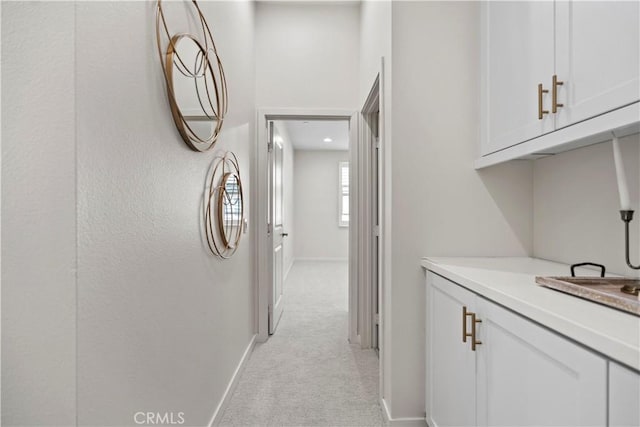 166 Borrego, Irvine, CA 92618 - hallway featuring light carpet and baseboards