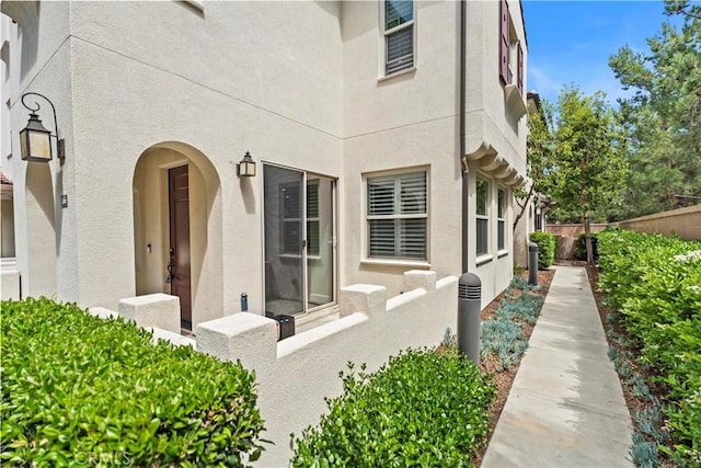 166 Borrego, Irvine, CA 92618 - doorway to property featuring stucco siding