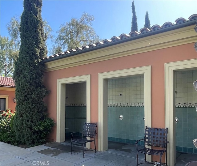166 Borrego, Irvine, CA 92618 - property entrance with a tile roof and stucco siding