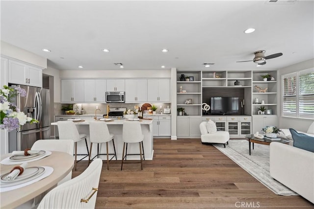 166 Borrego, Irvine, CA 92618 - living room featuring wood finished floors, recessed lighting, and a ceiling fan