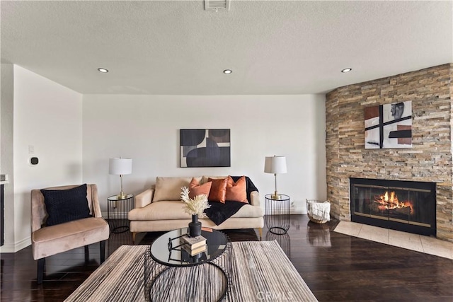 1436 257th St Unit 303, Harbor City, CA 90710 - living area with baseboards, wood finished floors, a fireplace, a textured ceiling, and recessed lighting