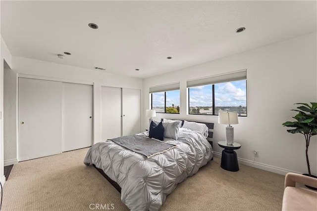 1436 257th St Unit 303, Harbor City, CA 90710 - bedroom with multiple closets, light colored carpet, baseboards, and recessed lighting