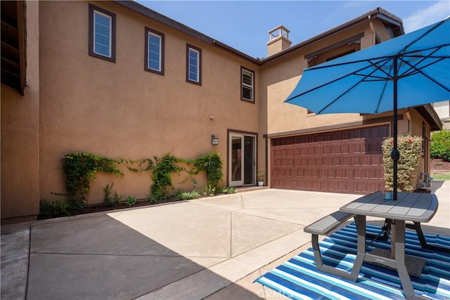 15530 New Park Ter, San Diego, CA 92127 - view of patio / terrace with concrete driveway and an attached garage