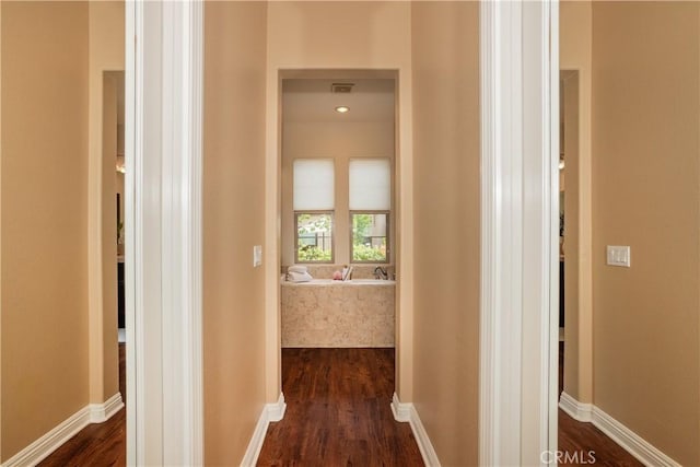15530 New Park Ter, San Diego, CA 92127 - hallway featuring dark wood-style floors and baseboards