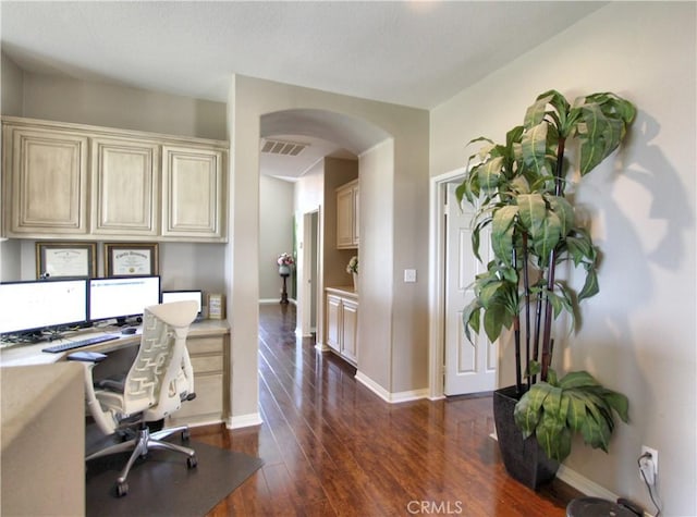 12949 Pinewood Ln, Yucaipa, CA 92399 - office space featuring arched walkways, dark wood-type flooring, and baseboards