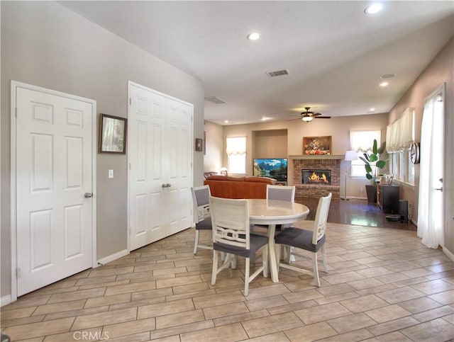 12949 Pinewood Ln, Yucaipa, CA 92399 - dining space featuring ceiling fan, a fireplace, recessed lighting, and baseboards