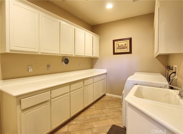 12949 Pinewood Ln, Yucaipa, CA 92399 - washroom with cabinet space, washing machine and dryer, baseboards, and recessed lighting