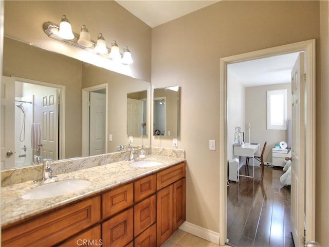 12949 Pinewood Ln, Yucaipa, CA 92399 - full bath featuring double vanity and baseboards