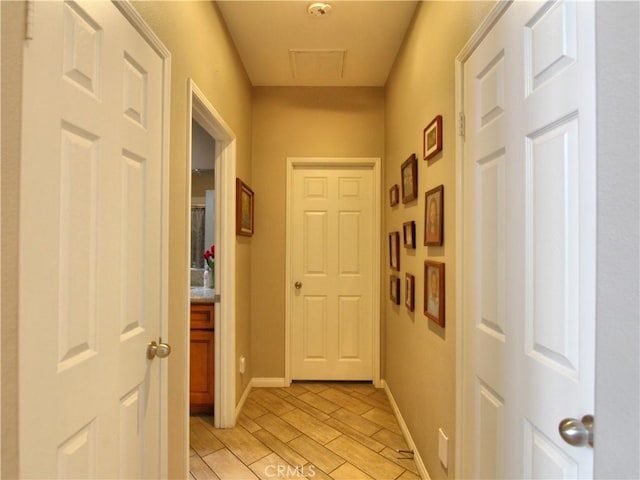 12949 Pinewood Ln, Yucaipa, CA 92399 - hallway with wood tiled floors and baseboards
