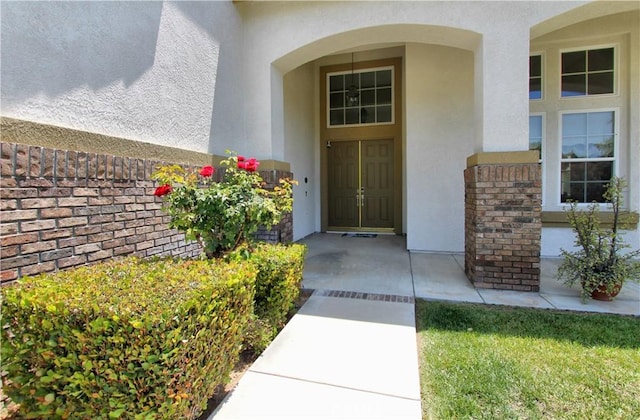 12949 Pinewood Ln, Yucaipa, CA 92399 - property entrance featuring stucco siding and brick siding