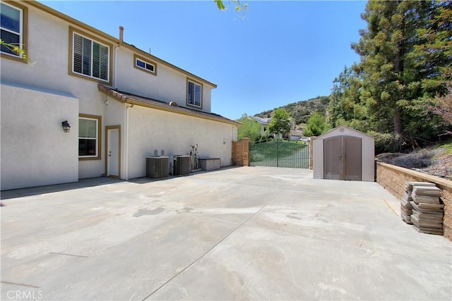 12949 Pinewood Ln, Yucaipa, CA 92399 - view of patio featuring central AC