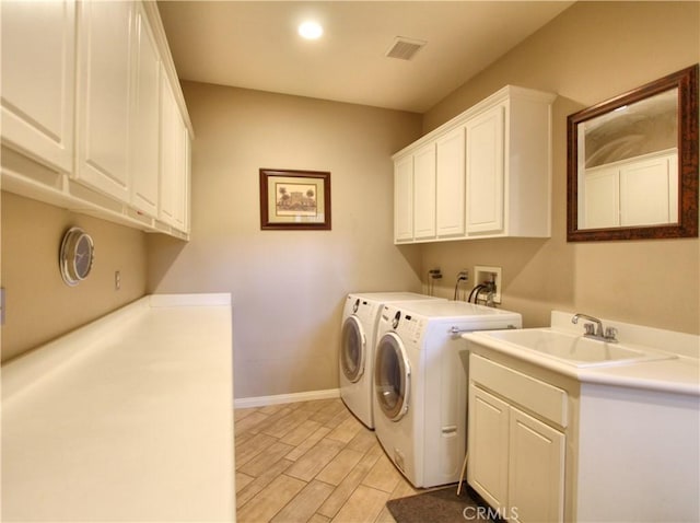 12949 Pinewood Ln, Yucaipa, CA 92399 - washroom with cabinet space, washer and dryer, and baseboards