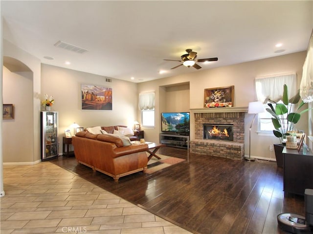 12949 Pinewood Ln, Yucaipa, CA 92399 - living room with a ceiling fan, a brick fireplace, baseboards, recessed lighting, and wood finished floors