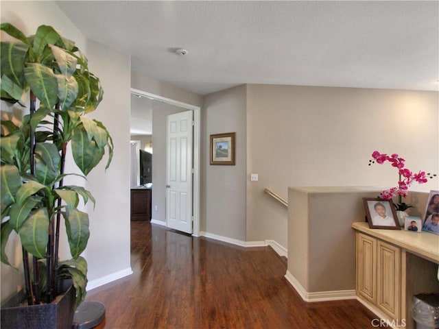 12949 Pinewood Ln, Yucaipa, CA 92399 - hallway with wood finished floors, an upstairs landing, and baseboards