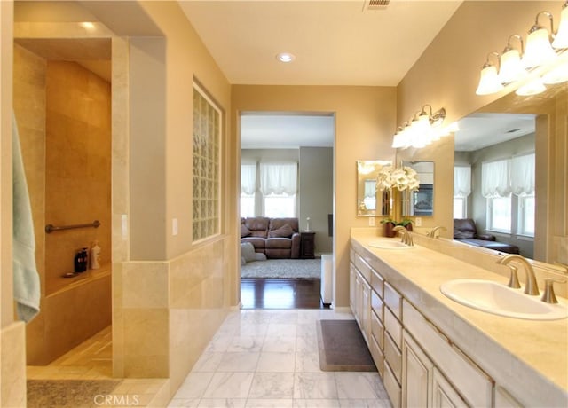 12949 Pinewood Ln, Yucaipa, CA 92399 - ensuite bathroom with a chandelier, double vanity, walk in shower, and marble finish floors