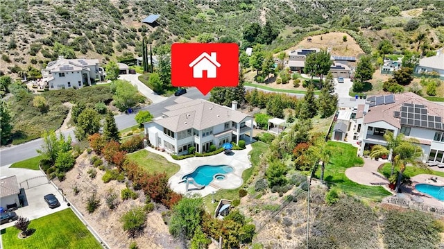 12949 Pinewood Ln, Yucaipa, CA 92399 - aerial perspective of suburban area with a pool area