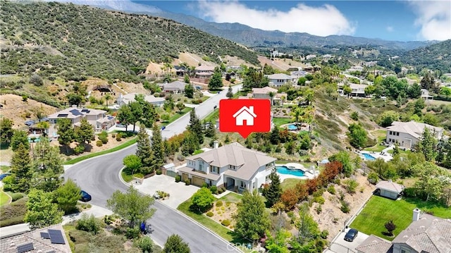 12949 Pinewood Ln, Yucaipa, CA 92399 - aerial view of residential area featuring a mountainous background and a pool