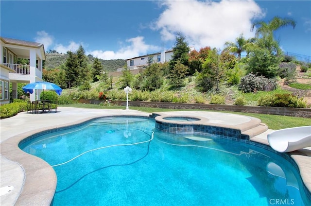 12949 Pinewood Ln, Yucaipa, CA 92399 - view of swimming pool with an in-ground hot tub, a patio area, and a water slide