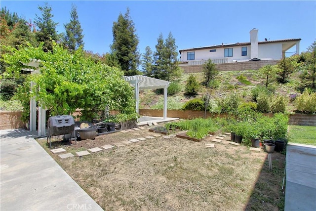 12949 Pinewood Ln, Yucaipa, CA 92399 - view of yard with a vegetable garden and a pergola