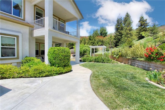 12949 Pinewood Ln, Yucaipa, CA 92399 - view of green lawn with a balcony
