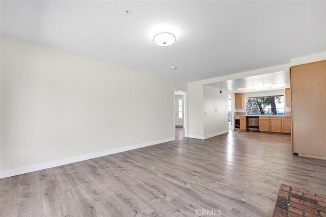 2472 Forbes Ave, Claremont, CA 91711 - unfurnished living room featuring light wood-style flooring and baseboards