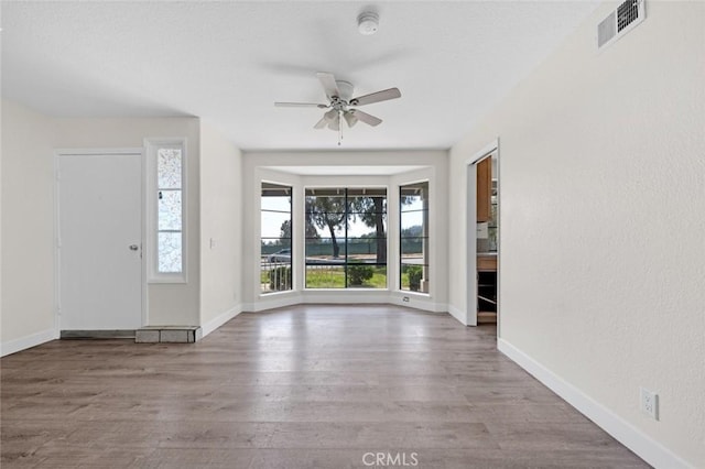 2472 Forbes Ave, Claremont, CA 91711 - foyer featuring ceiling fan, wood finished floors, and baseboards