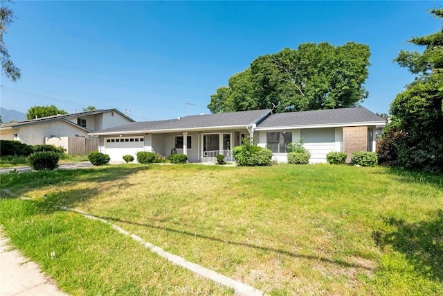 2472 Forbes Ave, Claremont, CA 91711 - view of front of house featuring a garage, a front lawn, and covered porch