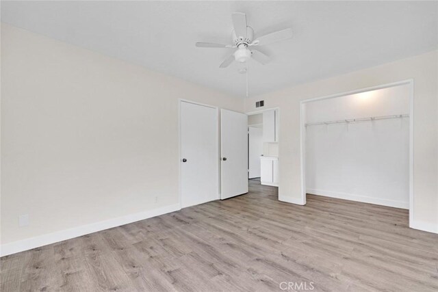 2472 Forbes Ave, Claremont, CA 91711 - unfurnished bedroom featuring wood finished floors, baseboards, and a closet
