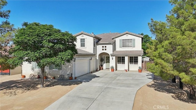 6688 Banyan Ave, Hesperia, CA 92345 - traditional-style home with driveway, stucco siding, a garage, and a tile roof