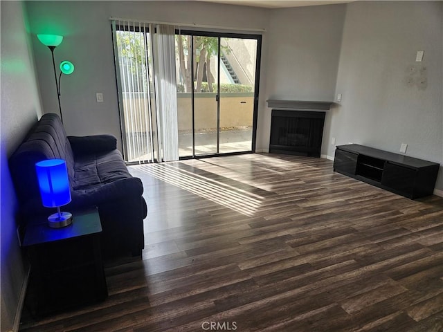 3532 W Stonepine Ln Unit B, Anaheim, CA 92804 - living room with wood finished floors, a fireplace, and baseboards