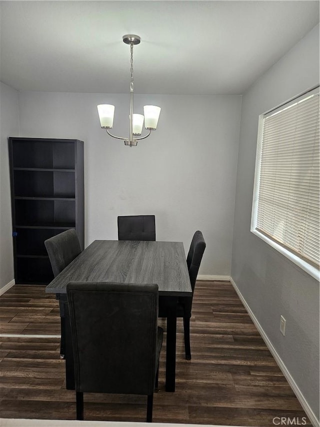 3532 W Stonepine Ln Unit B, Anaheim, CA 92804 - dining space featuring a chandelier, dark wood-style flooring, and baseboards