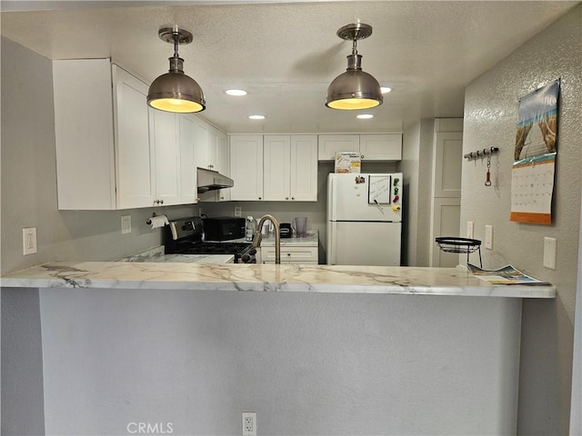 3532 W Stonepine Ln Unit B, Anaheim, CA 92804 - kitchen featuring freestanding refrigerator, gas stove, a peninsula, under cabinet range hood, and a textured wall