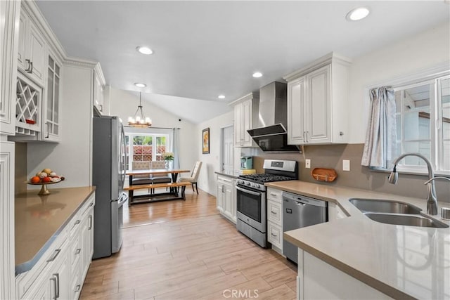 1420 Bookman Ave, Walnut, CA 91789 - kitchen featuring stainless steel appliances, a sink, wall chimney exhaust hood, a chandelier, and light wood finished floors