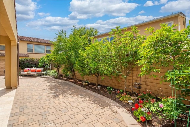 323 La Ventana Dr, Brea, CA 92823 - fenced backyard featuring an outdoor hangout area and a patio
